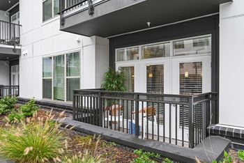 the front of a building with windows and a balcony at Link Apartments® Mint Street, North Carolina, 28203